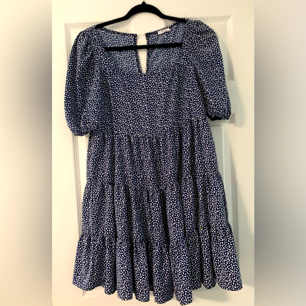 Adorable baby doll dress with squared neck.
